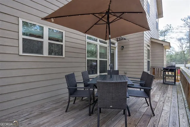 a table and chairs in patio of the house