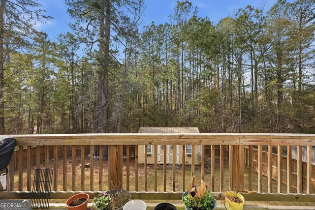 a view of a two chairs on the deck