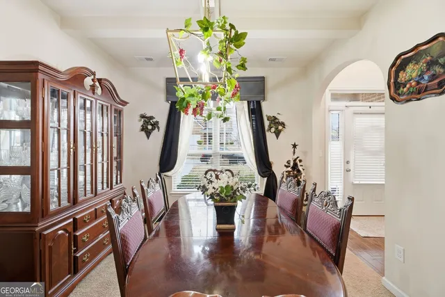 a view of living room with furniture and a chandelier