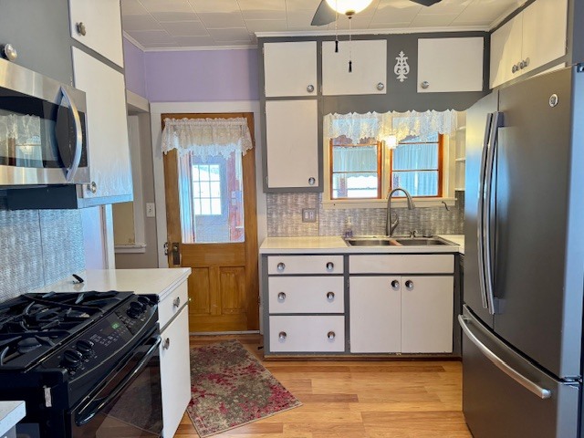 2918 Pershing Boulevard Clinton, IA 52732 - Photo 4 of 33 a kitchen with stainless steel appliances granite countertop a refrigerator stove and sink