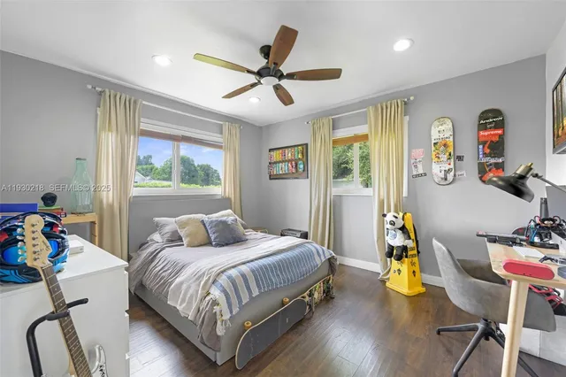 a bedroom with a bed furniture and a window