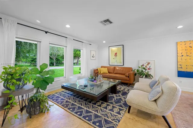 a living room with furniture and a window