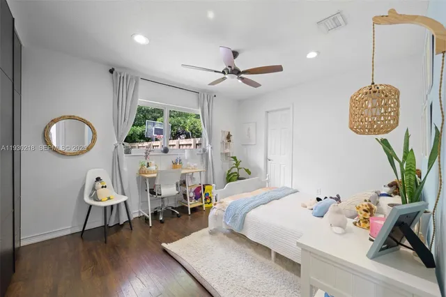 a bedroom with furniture and a window