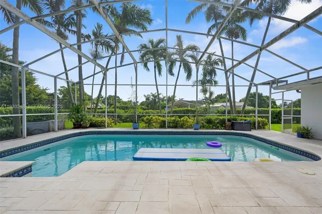 a view of swimming pool with a lounge chair