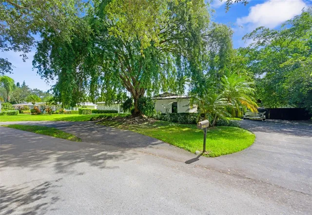 a view of a house with a park