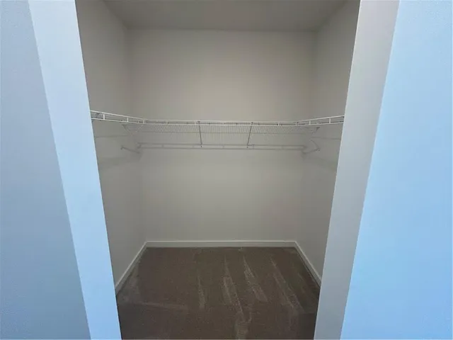 a bathroom with a double vanity sink and mirror with shower