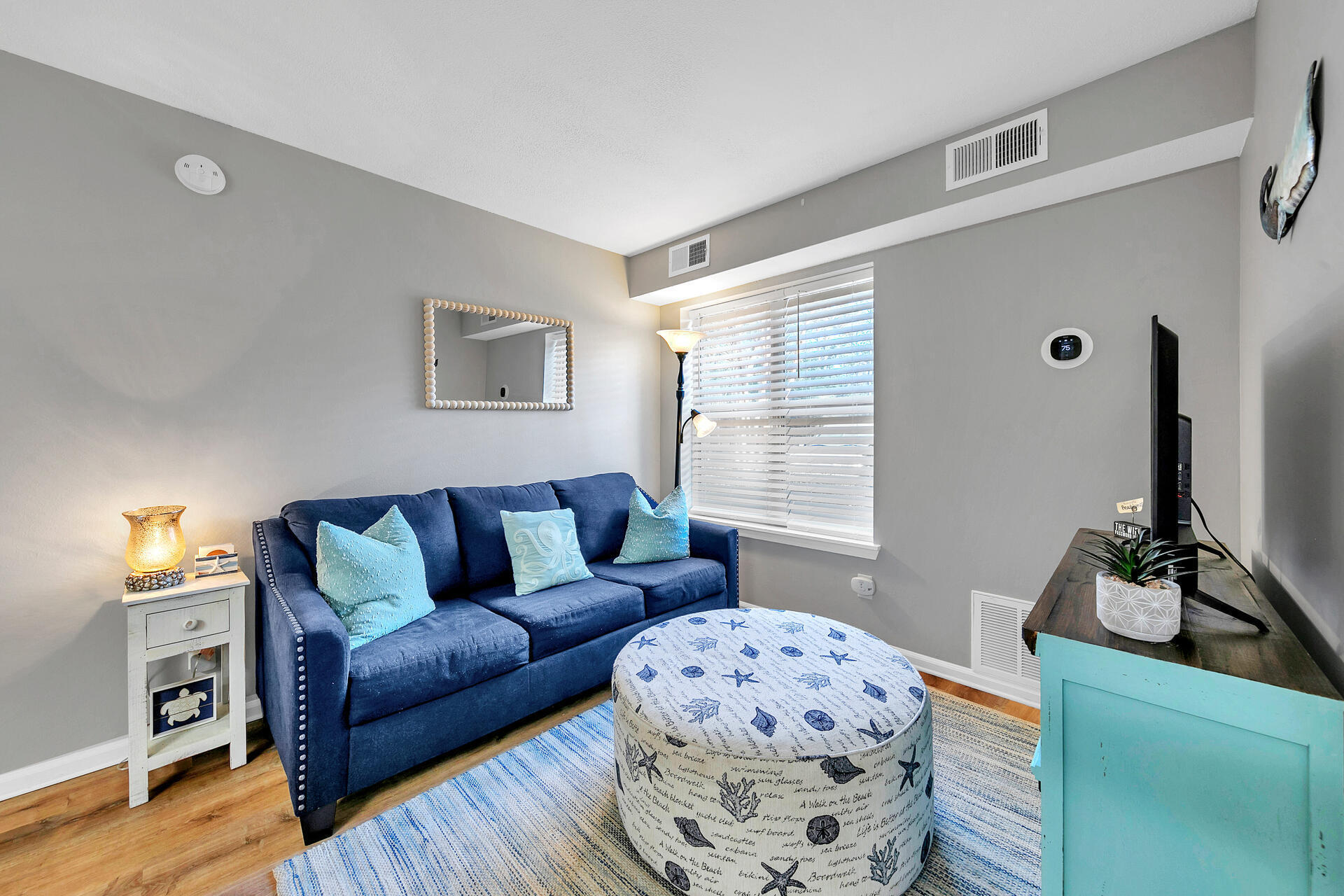 200 Sandestin Lane, Unit 602 Miramar Beach, FL 32550 - Photo 3 of 17 a living room with furniture and a flat screen tv
