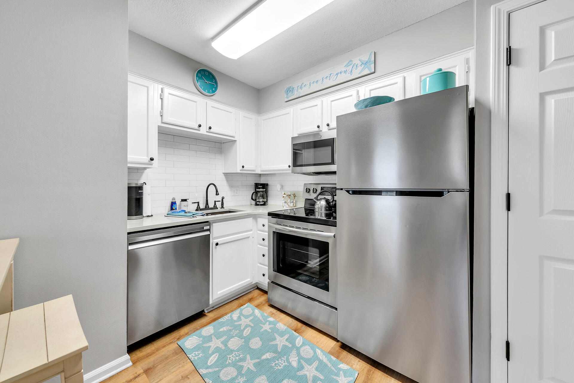 200 Sandestin Lane, Unit 602 Miramar Beach, FL 32550 - Photo 8 of 17 a kitchen with stainless steel appliances a refrigerator stove and sink