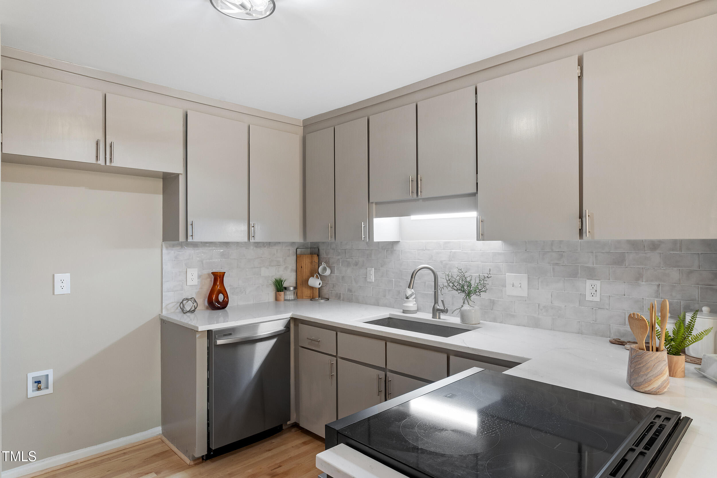 a kitchen with a sink and cabinets