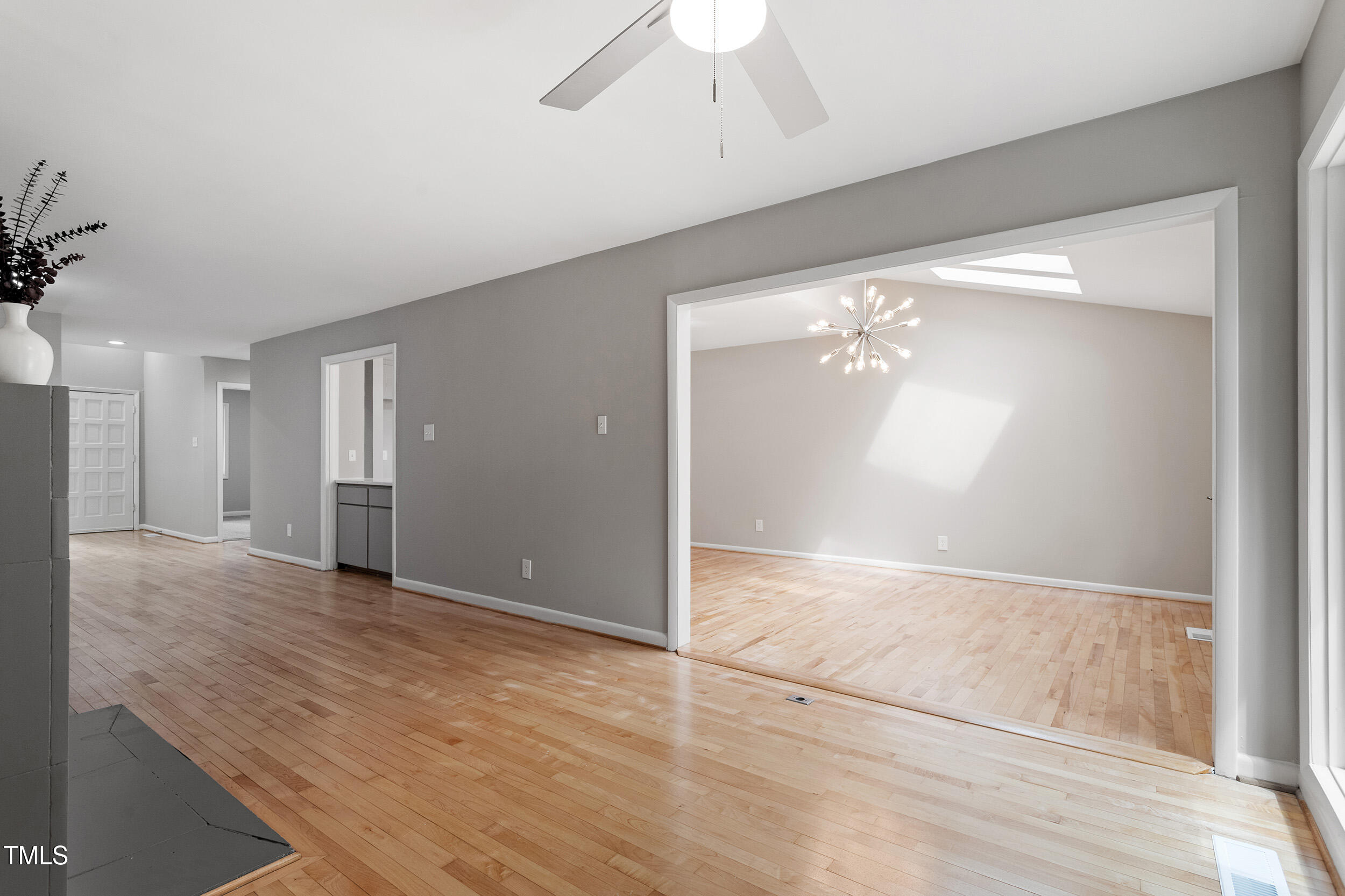 58 Stoneridge Road Durham, NC 27705 - Photo 16 of 38 an empty room with wooden floor and windows