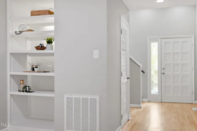 a view of an entryway with wooden floor