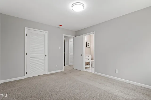 a bathroom with a granite countertop sink a toilet and bathtub