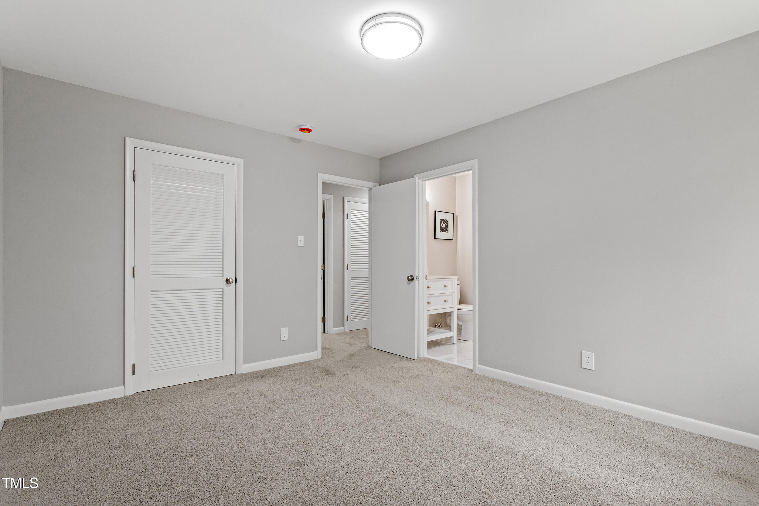 58 Stoneridge Road Durham, NC 27705 - Photo 25 of 38 an empty room with closet and windows