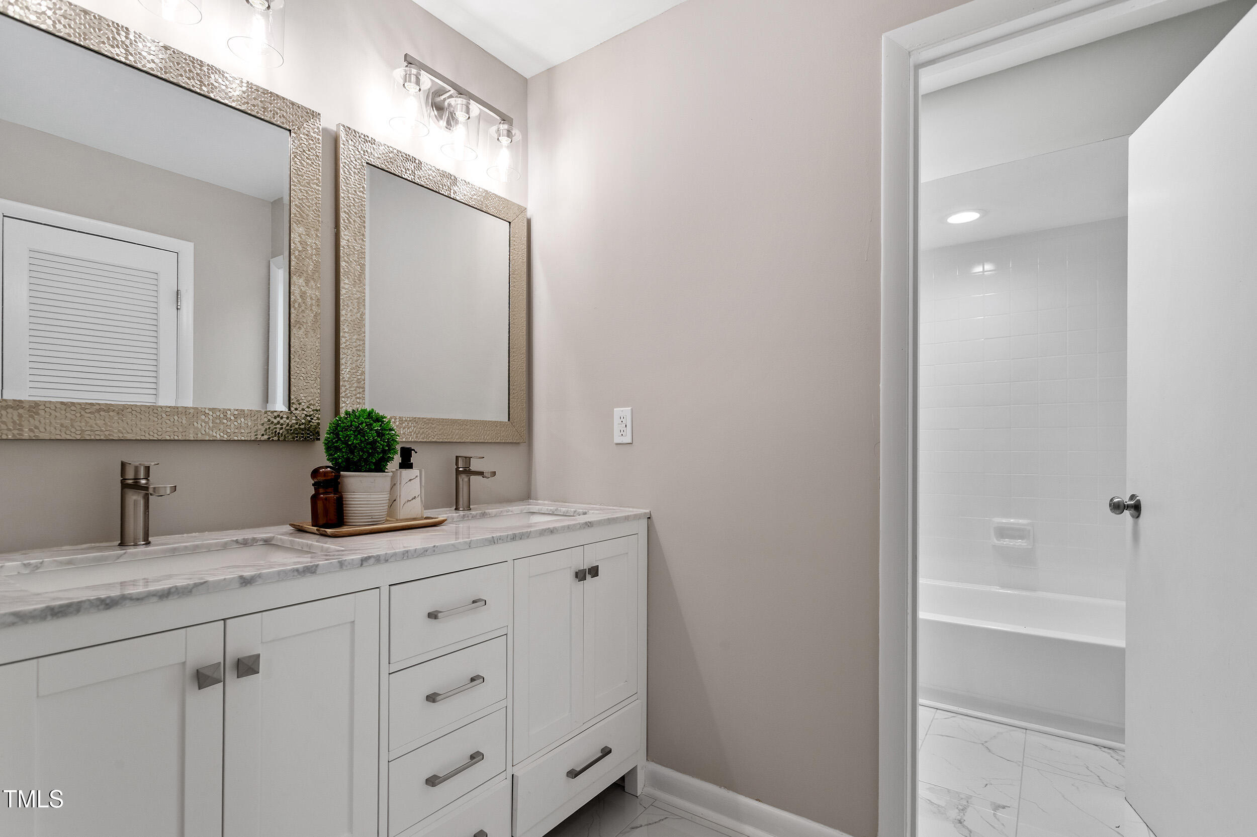 58 Stoneridge Road Durham, NC 27705 - Photo 27 of 38 a bathroom with a granite countertop sink and a mirror
