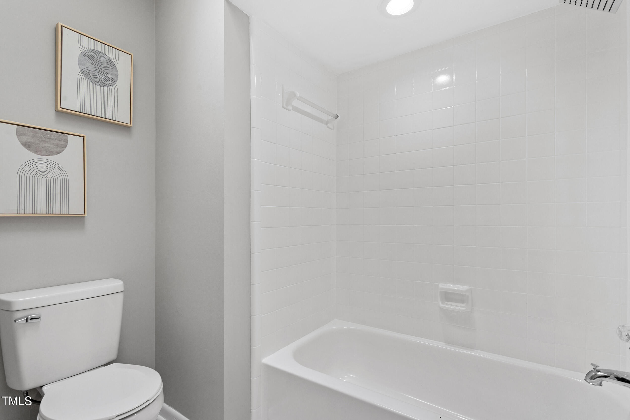 58 Stoneridge Road Durham, NC 27705 - Photo 28 of 38 a white toilet sitting next to a bath tub