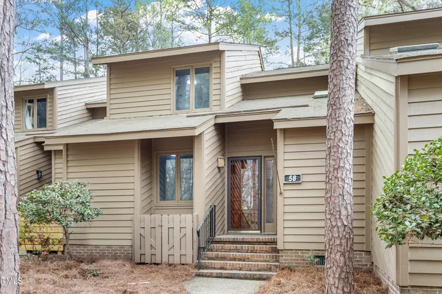 a view of a house with a window and stairs