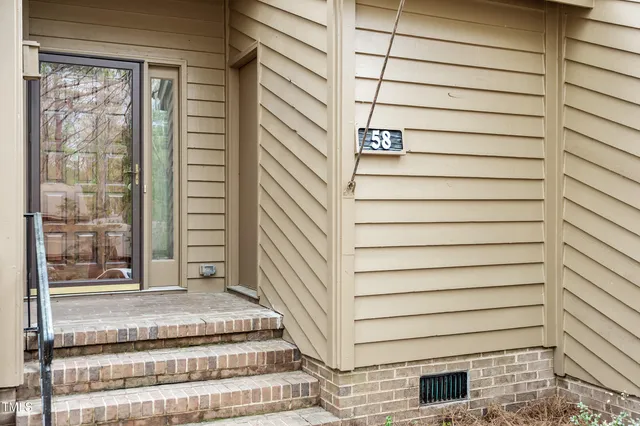 a view of a house with wooden door
