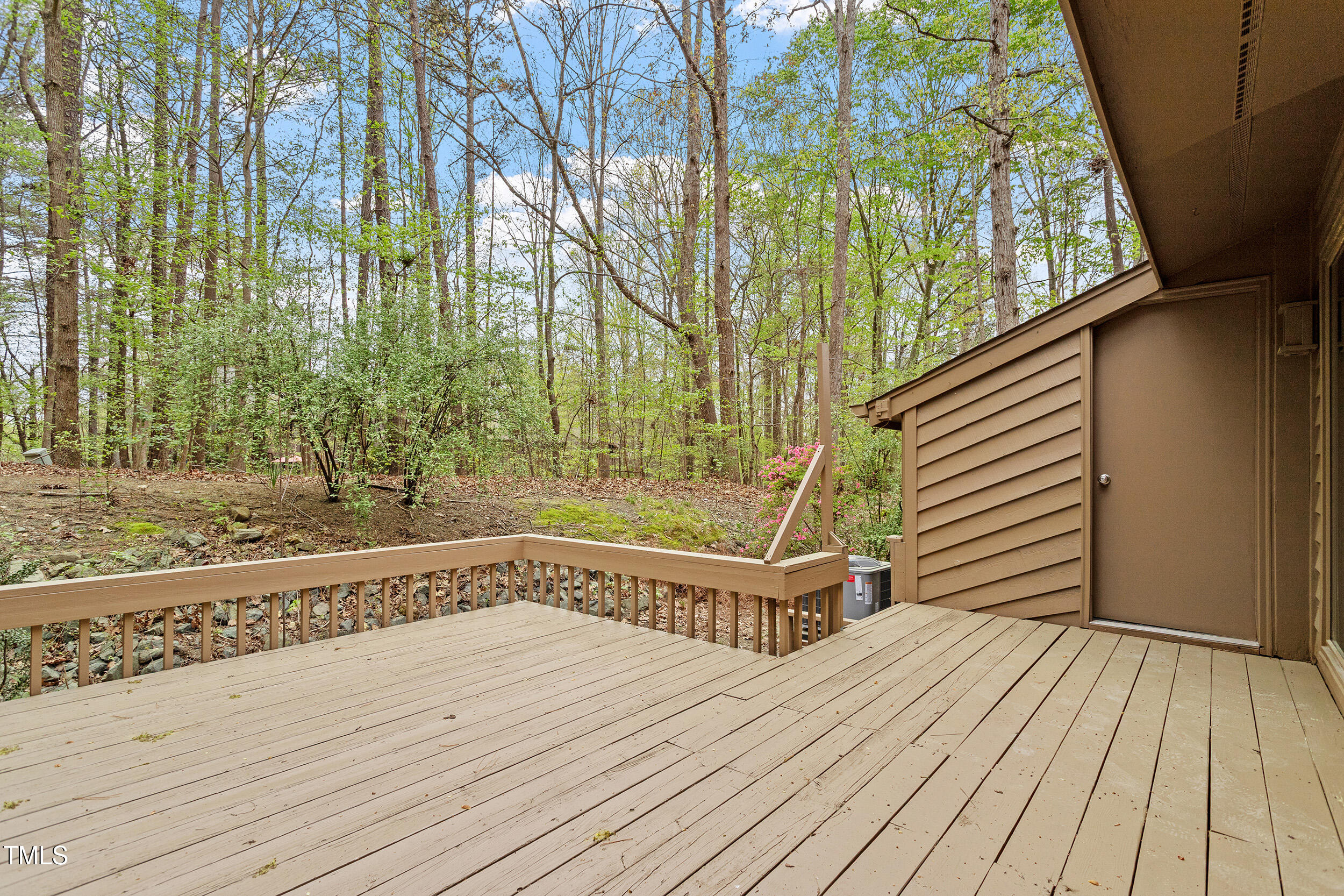 58 Stoneridge Road Durham, NC 27705 - Photo 36 of 38 a view of a wooden deck with a yard