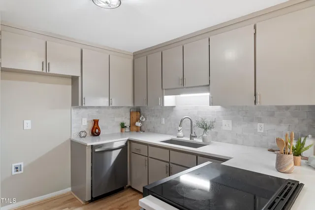 a kitchen with a sink and cabinets