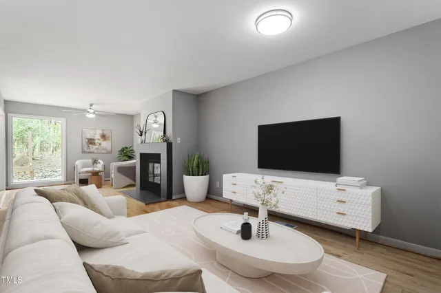 a living room with furniture and a flat screen tv