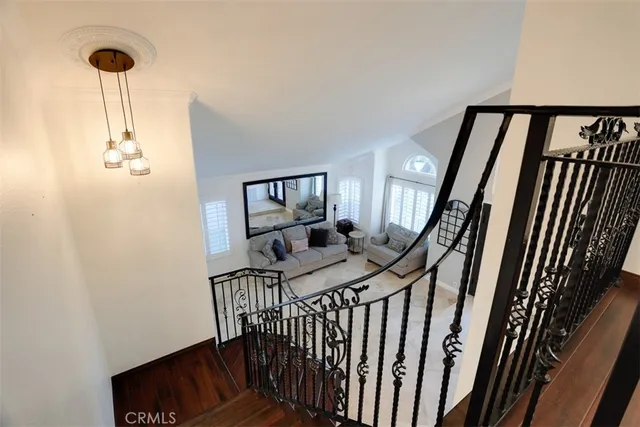 a view of a balcony with furniture and staircase