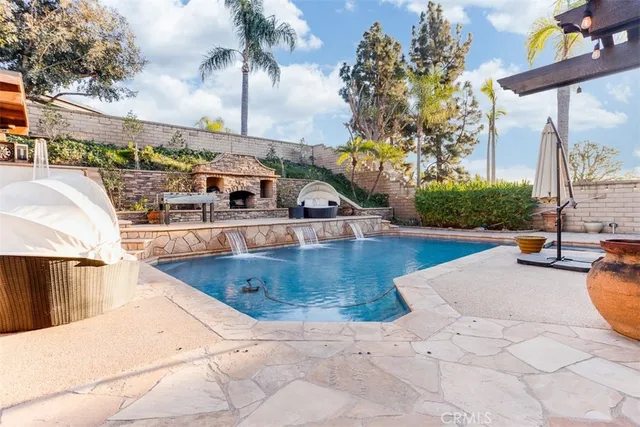 a view of a swimming pool with sitting area