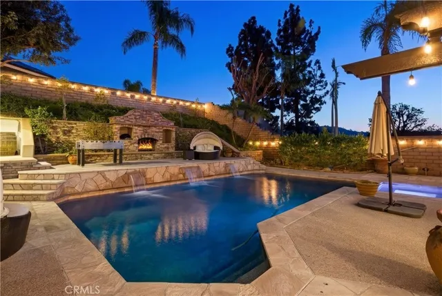 a view of a swimming pool with a patio