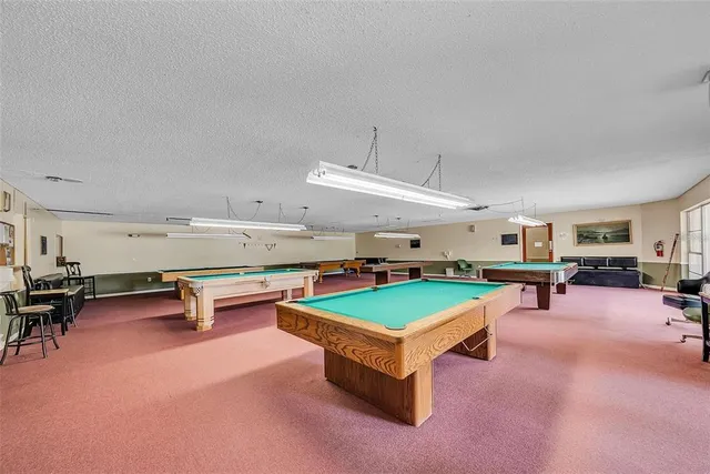 a view of a room with chairs and toys