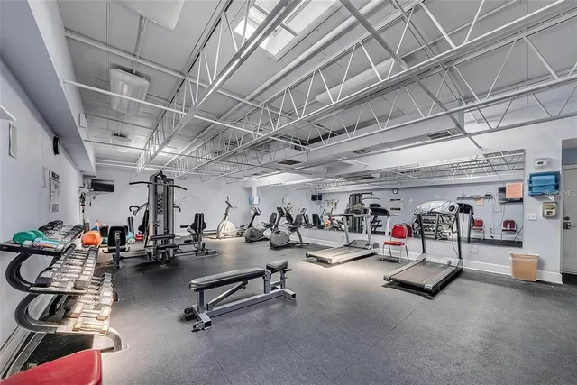 a view of gym room with gym equipment