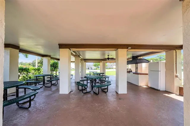 a view of a dining room with a table and chairs
