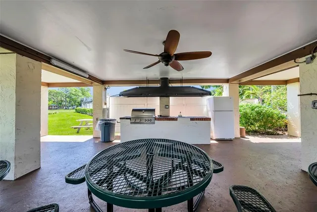 a kitchen with a stove a microwave and a refrigerator