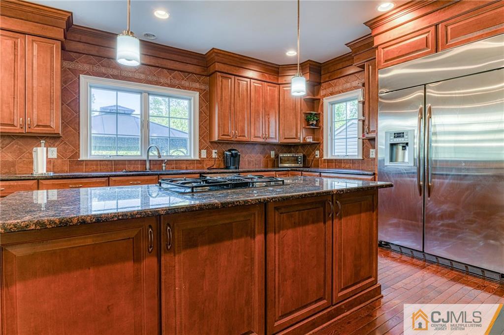 85 Davidson's Mill Road North Brunswick, NJ 08902 - Photo 17 of 39 a kitchen with stainless steel appliances granite countertop a sink a counter space and a window