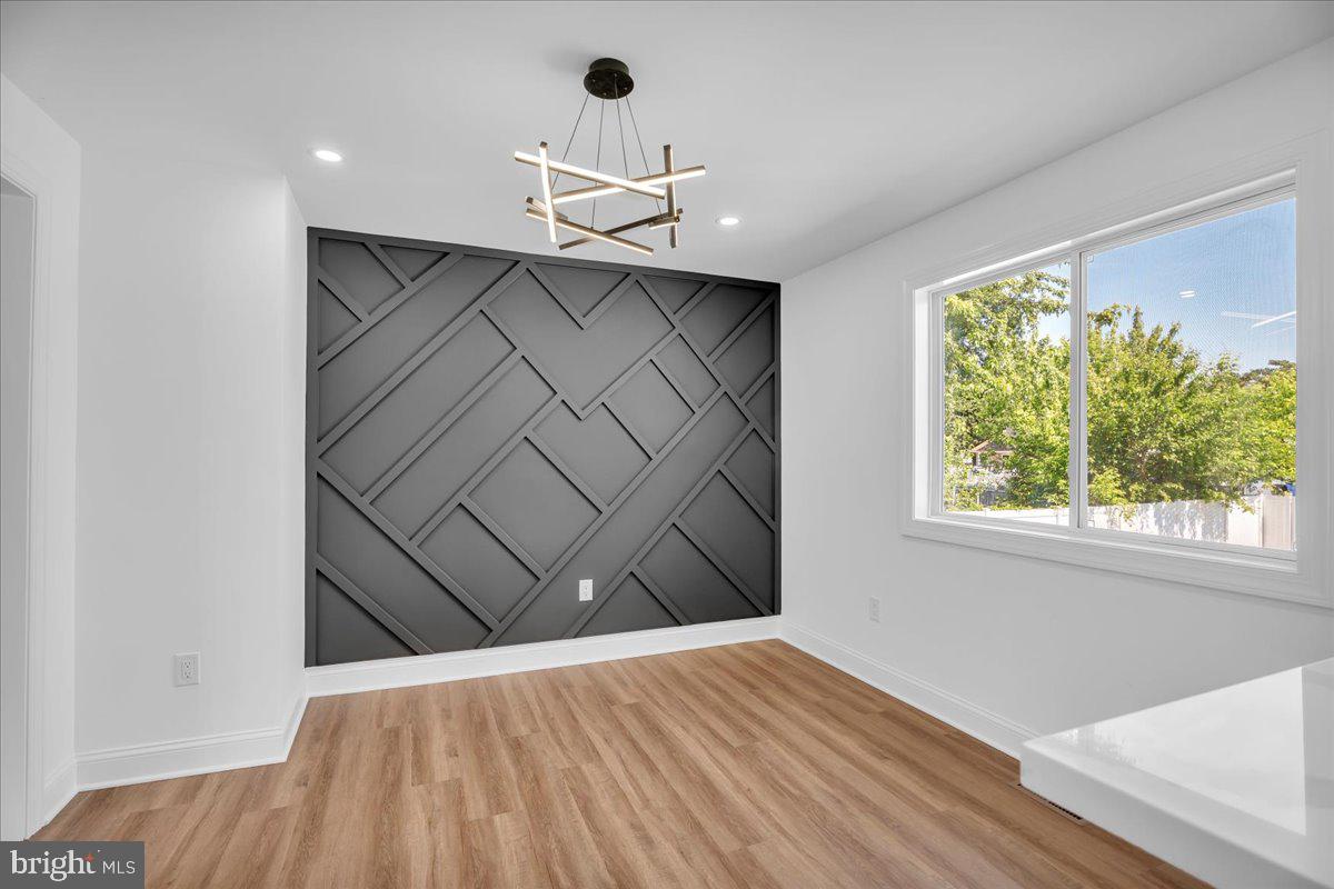 2504 Church Road Cinnaminson, NJ 08077 - Photo 14 of 79 an empty room with wooden floor fan and windows