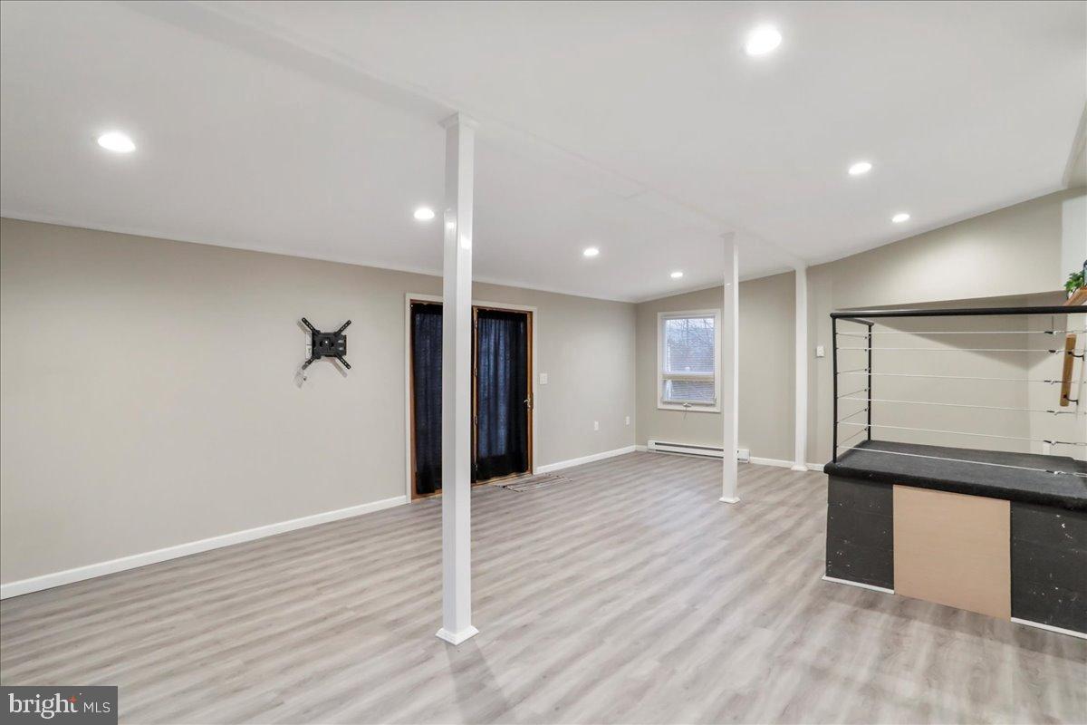 13815 Brant Road Southwest Cresaptown, MD 21502 - Photo 13 of 40 a view of an empty room with wooden floor and a window