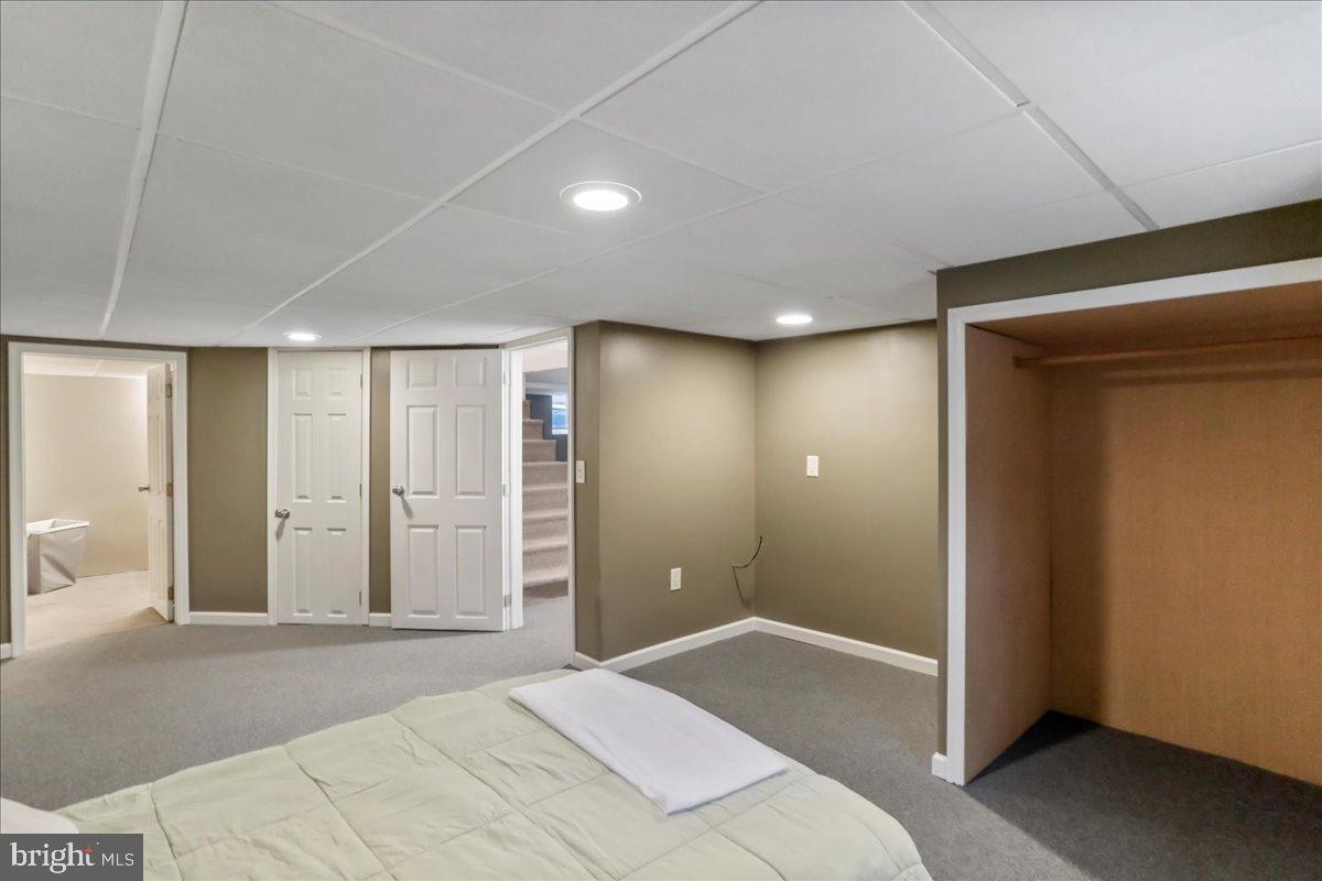 13815 Brant Road Southwest Cresaptown, MD 21502 - Photo 27 of 40 a bedroom with a bed and a mirror