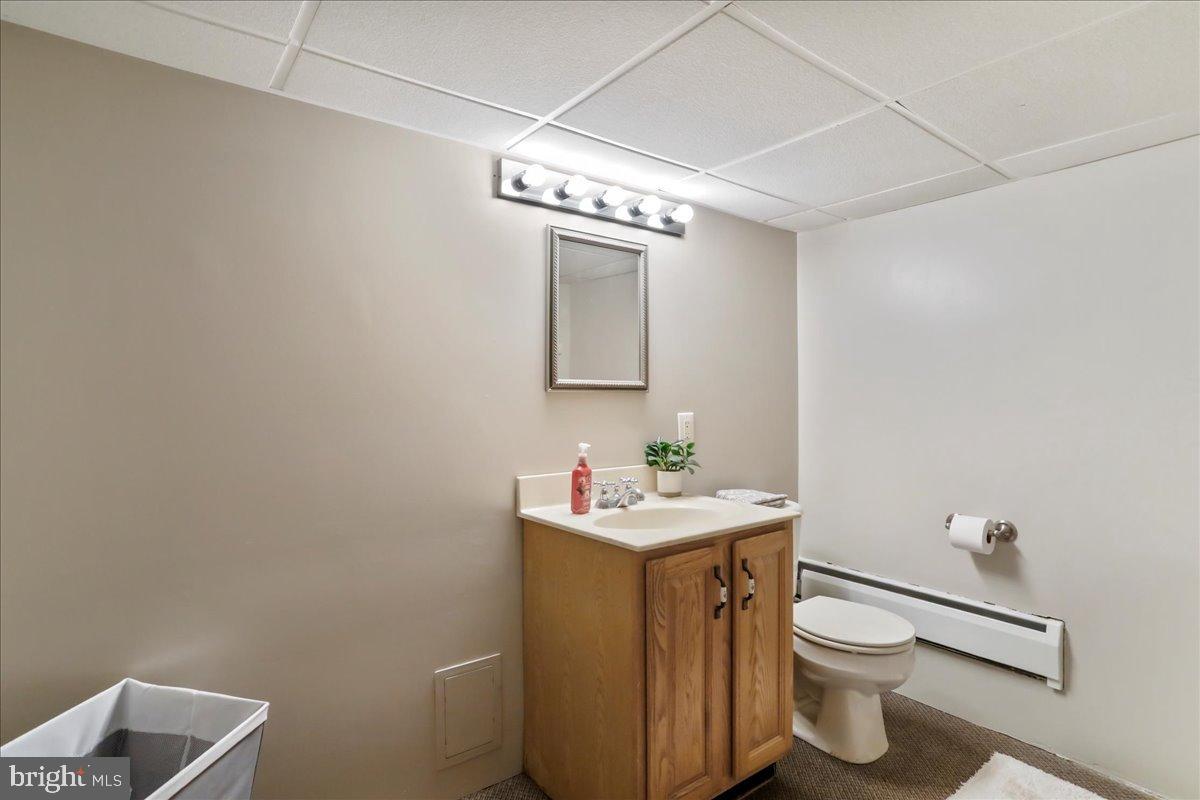 13815 Brant Road Southwest Cresaptown, MD 21502 - Photo 28 of 40 a bathroom with a toilet sink and mirror