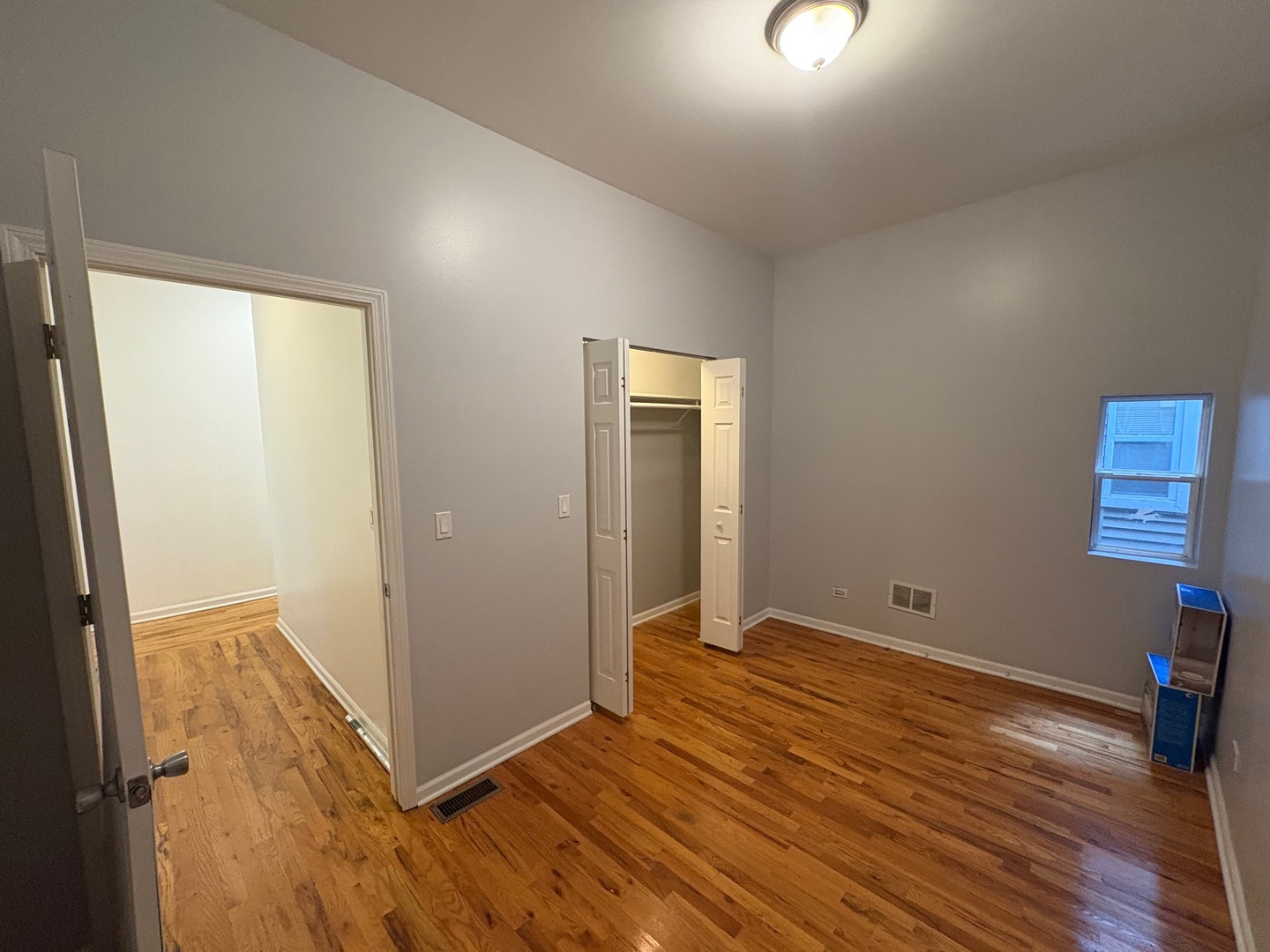 524 West 78th Street, Unit 1 Chicago, IL 60620 - Photo 4 of 9 a view of room with window and wooden floor