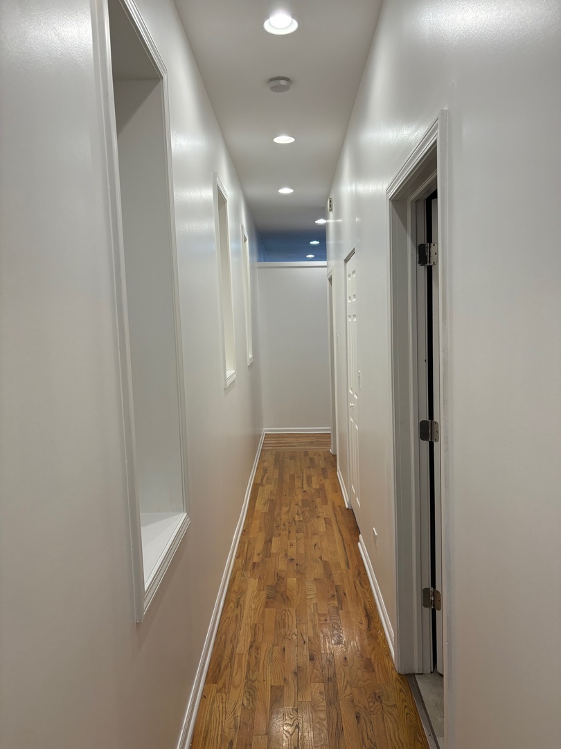 524 West 78th Street, Unit 1 Chicago, IL 60620 - Photo 5 of 9 a view of hallway with wooden floor