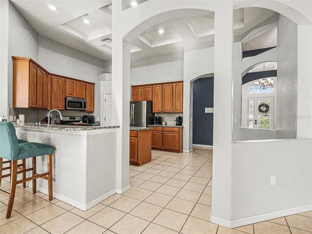 8443 Sailing Loop Lakewood Ranch, FL 34202 - Photo 15 of 34 a kitchen with stainless steel appliances a refrigerator sink and cabinets