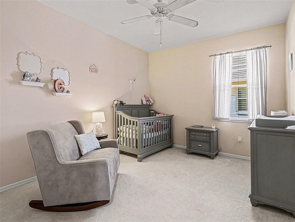 8443 Sailing Loop Lakewood Ranch, FL 34202 - Photo 24 of 34 a living room with furniture and windows
