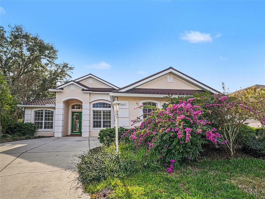 8443 Sailing Loop Lakewood Ranch, FL 34202 - Photo 6 of 34 a front view of a house with a yard