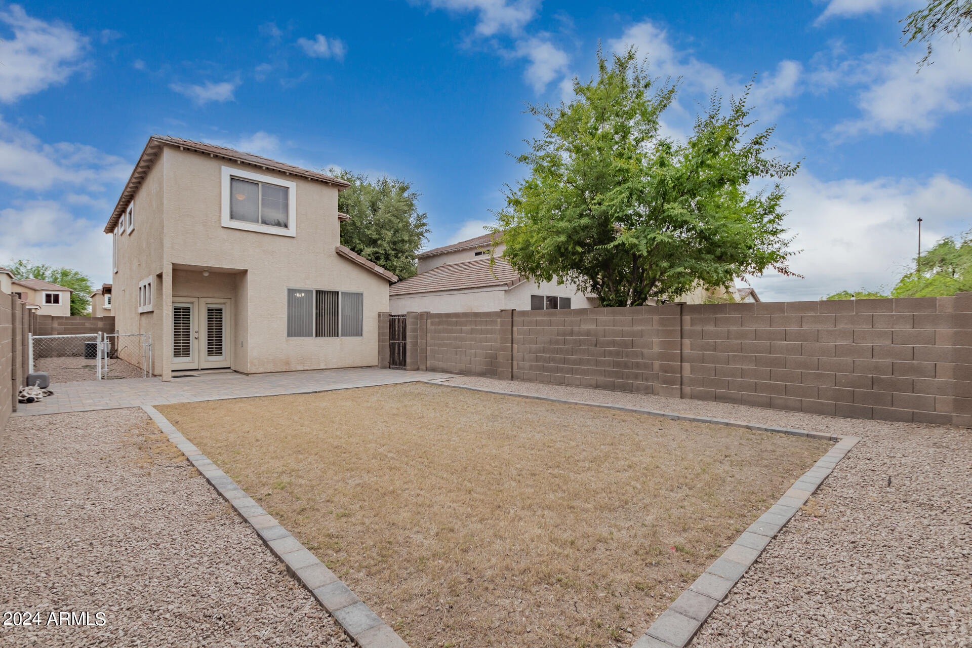 1371 South Boulder Street, Unit A Gilbert, AZ 85296 - Photo 39 of 43 a backyard of a house