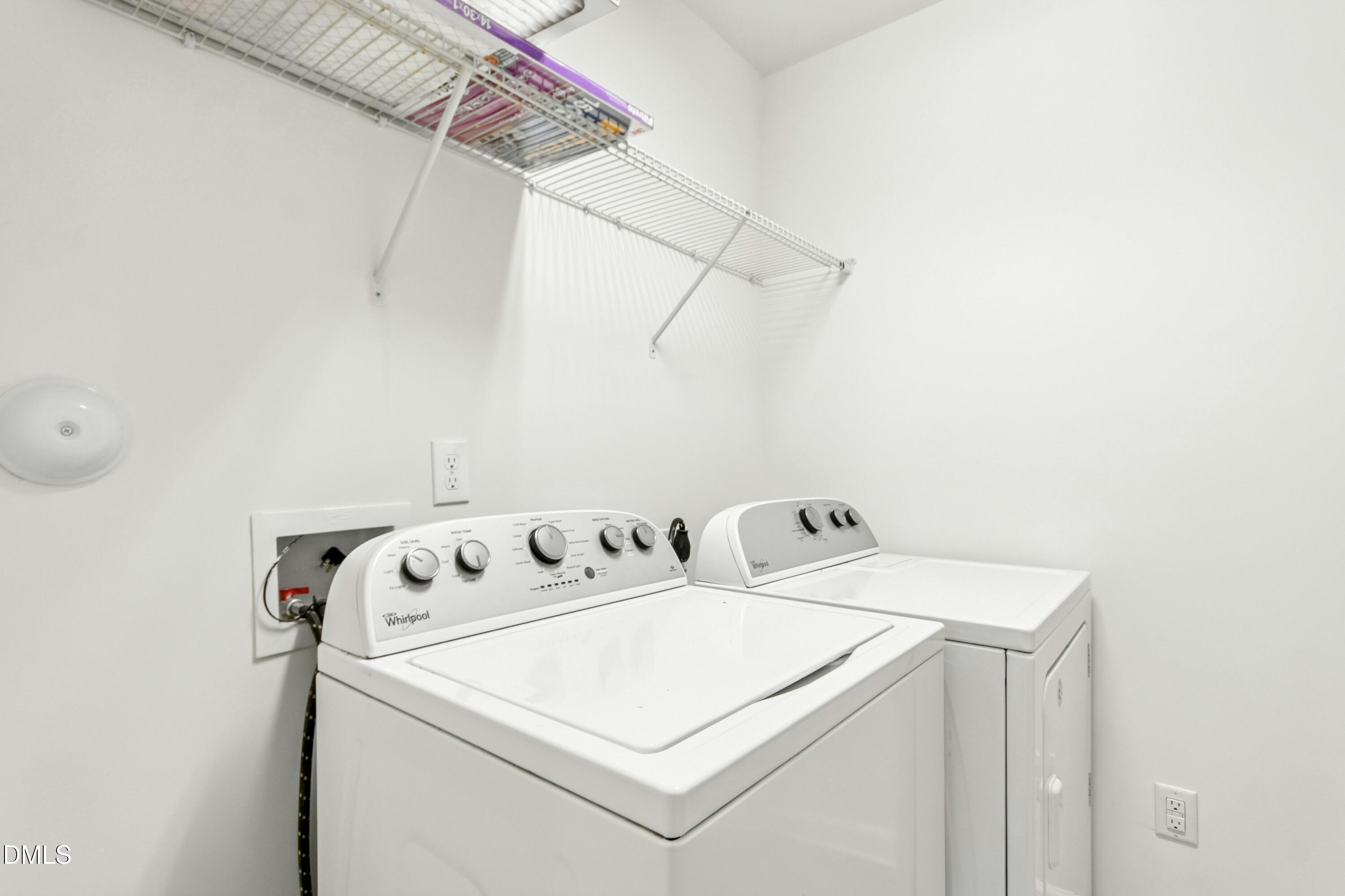 125 Spring Pine Lane Holly Springs, NC 27540 - Photo 27 of 34 a utility room with dryer and washer