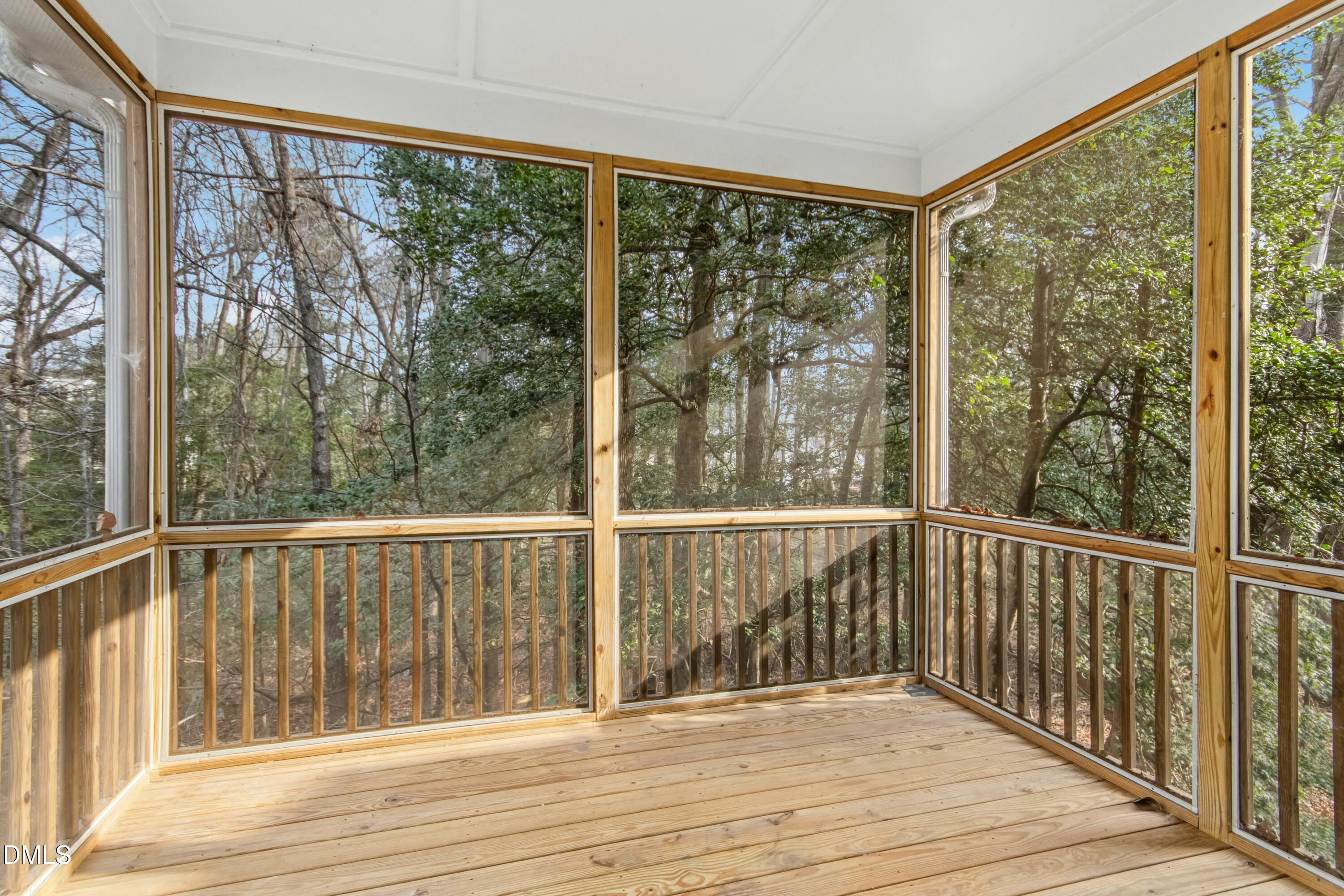 125 Spring Pine Lane Holly Springs, NC 27540 - Photo 28 of 34 a view of a balcony with wooden floor