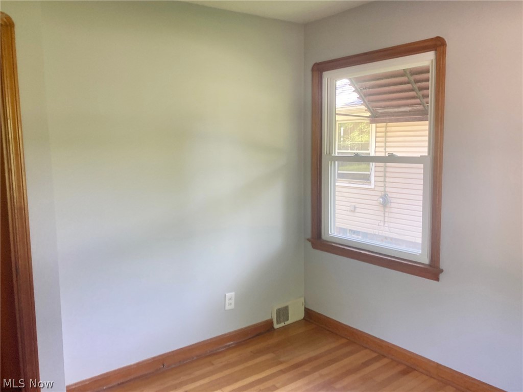 24249 Chardon Road Cleveland, OH 44143 - Photo 16 of 26 Empty room featuring hardwood / wood-style flooring
