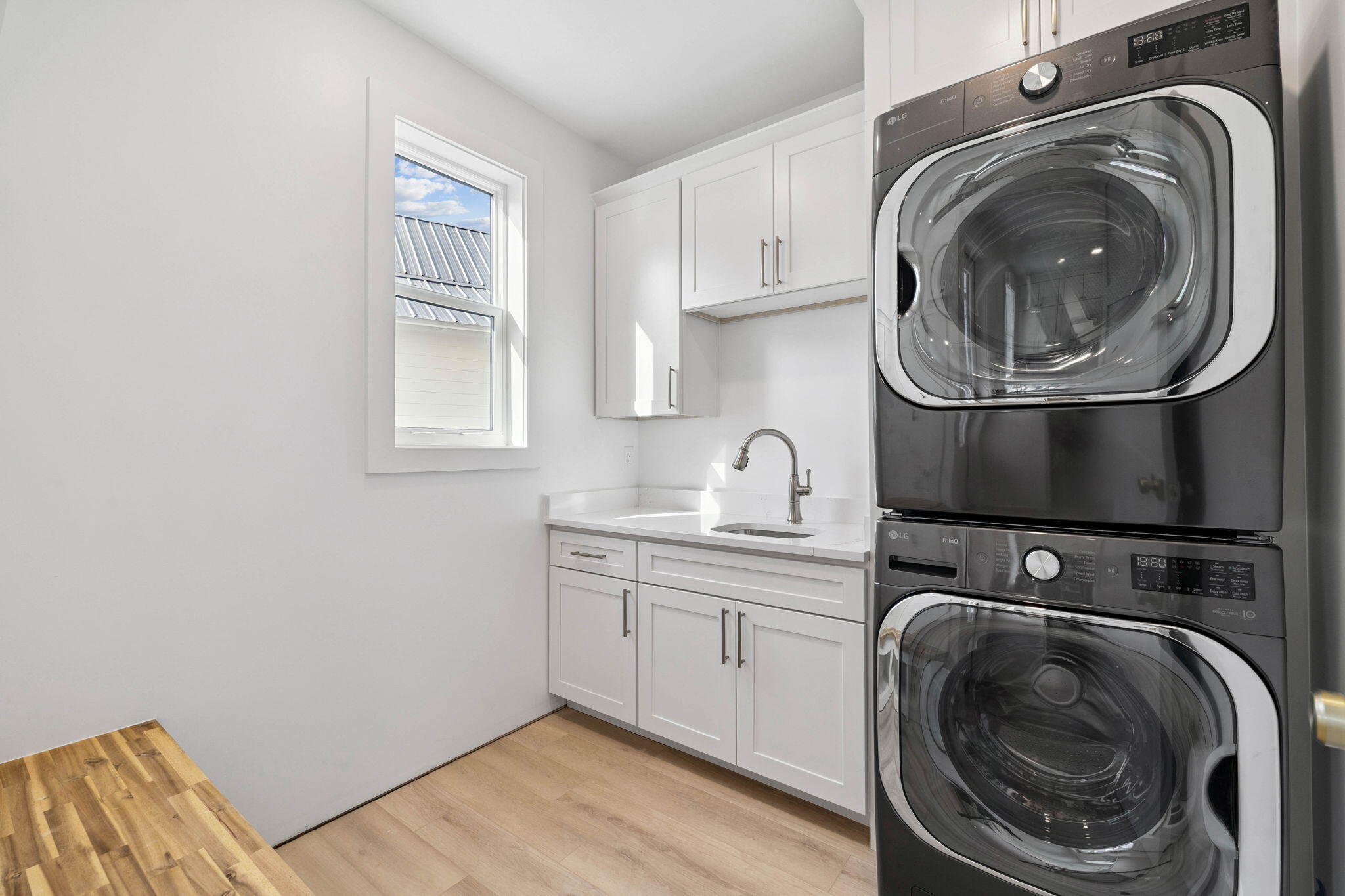 264 Dockside Drive Port St. Joe, FL 32456 - Photo 17 of 65 a utility room with sink dryer and washer