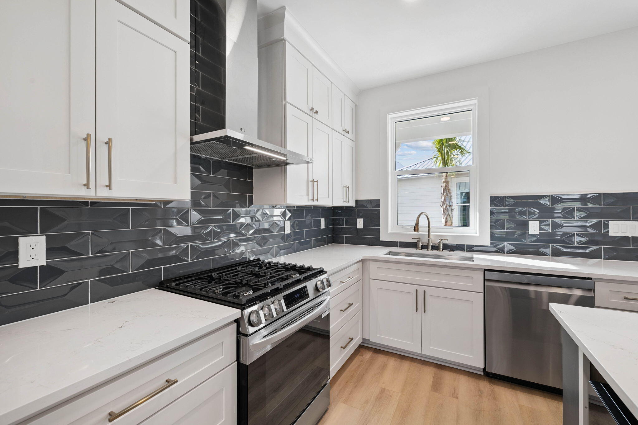 264 Dockside Drive Port St. Joe, FL 32456 - Photo 21 of 65 a kitchen with a sink stove and cabinets