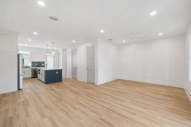 a bathroom with double sink and a mirror