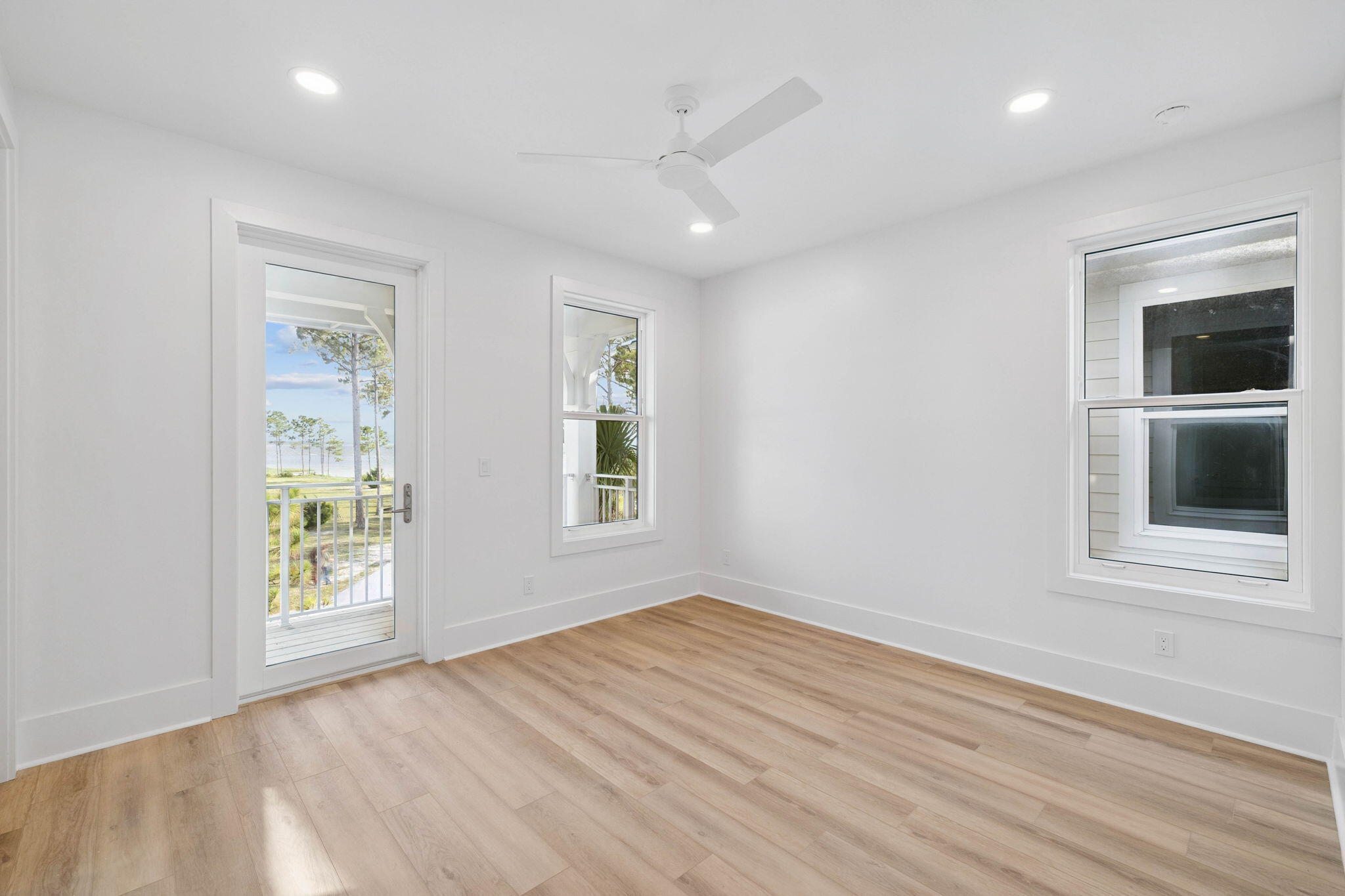 264 Dockside Drive Port St. Joe, FL 32456 - Photo 26 of 65 an empty room with wooden floor and windows