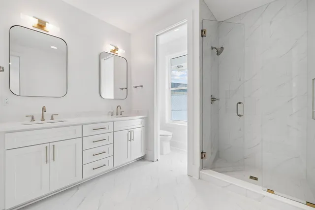 an aerial view of a house with a yard basket ball court and outdoor seating